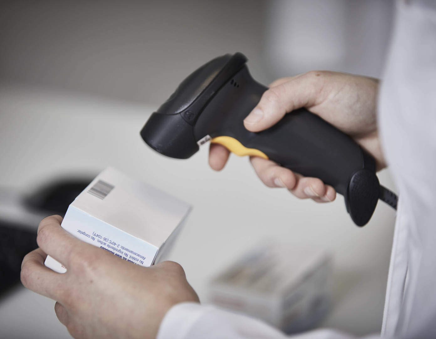 A scanner scanning a barcode on an American Health Packaging product