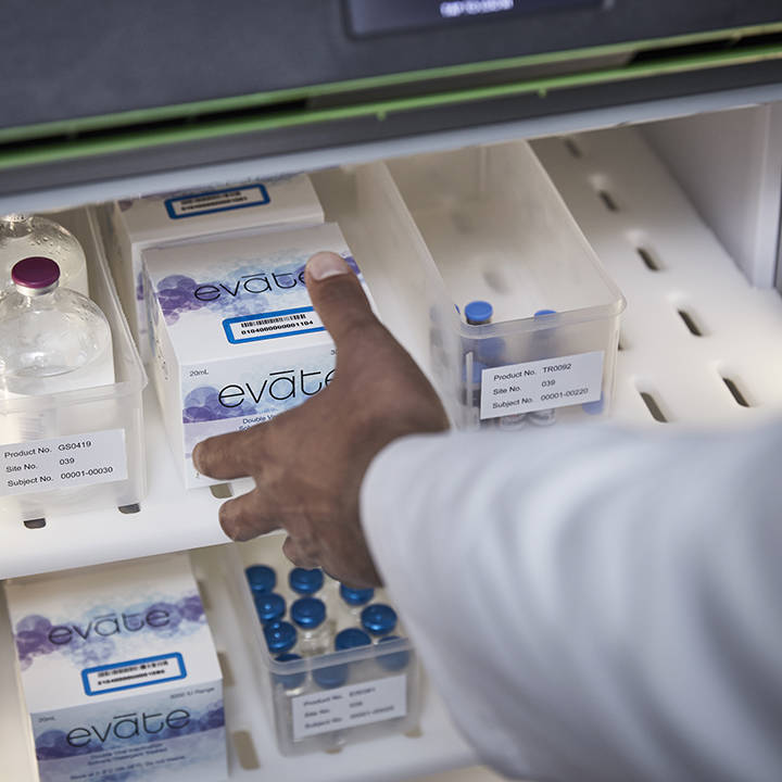 A hand reaching into a CubixxMD cabinet