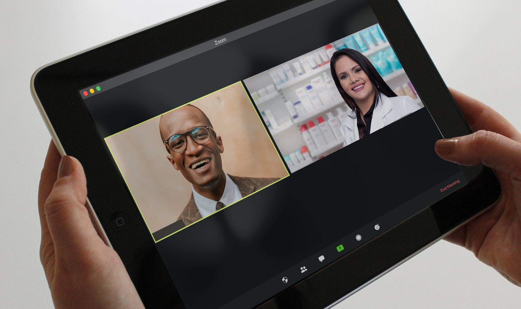 A pharmacist hosts a virtual meeting with an elected official on her tablet