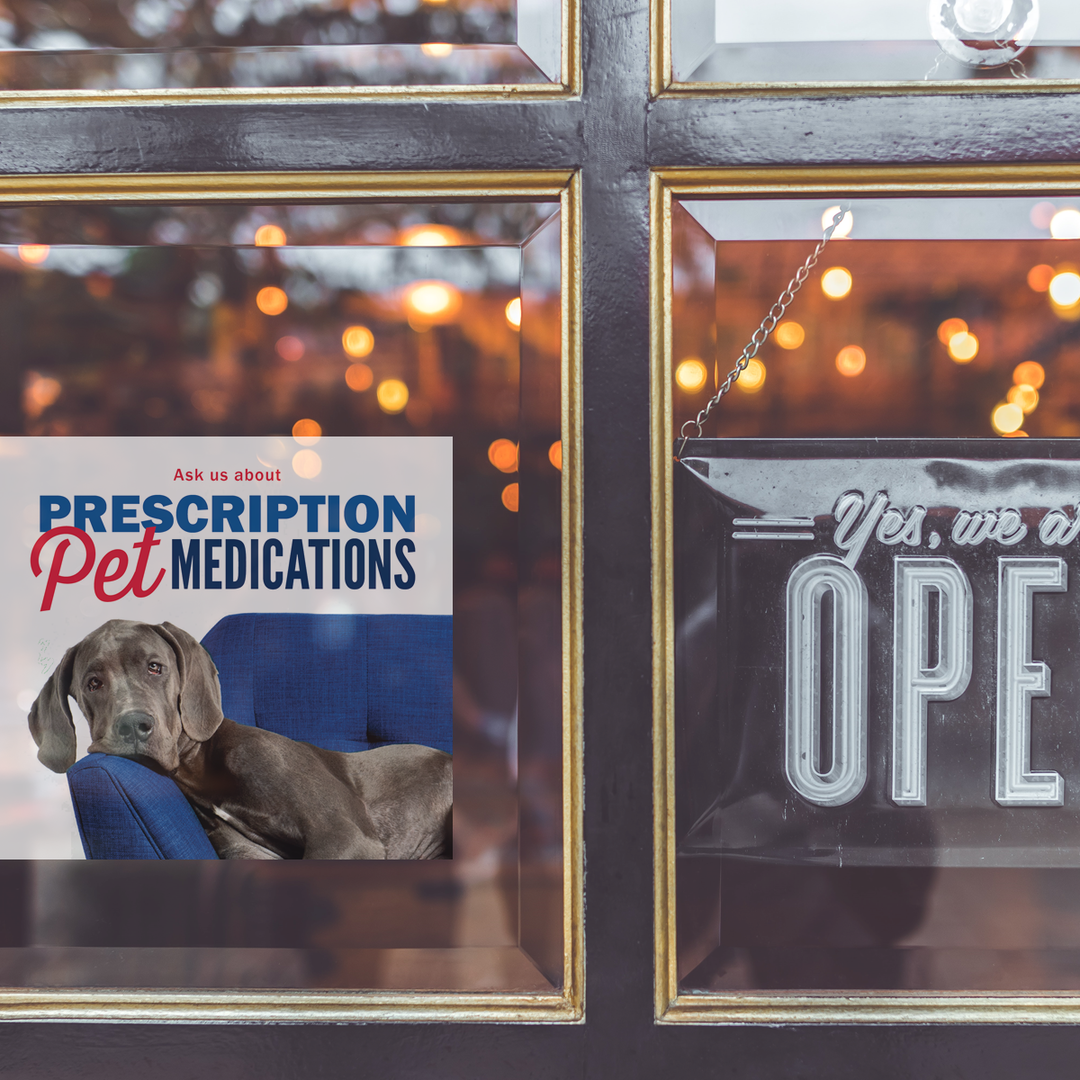 A window cling on a pharmacy front door promoting pet health